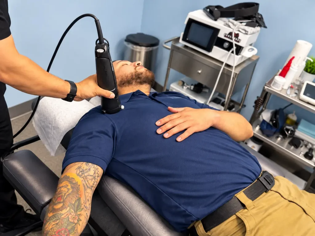 Patient receiving Rapid Release Technology treatment on the shoulder at Lone Star Goodlife